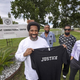Sullivan Walter, 53, left, holds a shirt near Elayn Hunt Correctional Center in St. Gabriel, La., with, left to right, his brothers Corner Walter, Jr. and Byron Walter, Sr., and Innocence Project New Orleans legal director Richard Davis, just after his release on Thursday, Aug. 25, 2022.